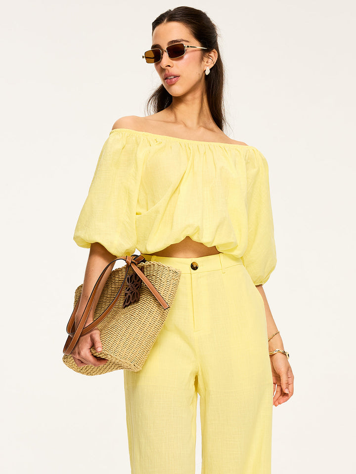 Blouse à manches bouffantes et nouée au dos