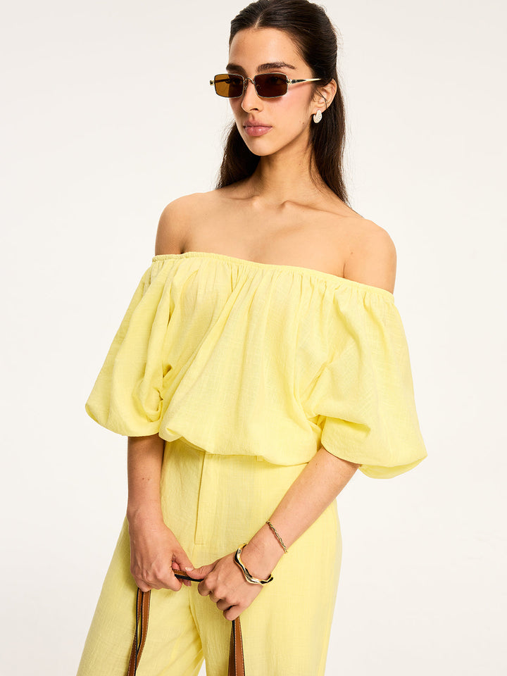 Blouse à manches bouffantes et nouée au dos