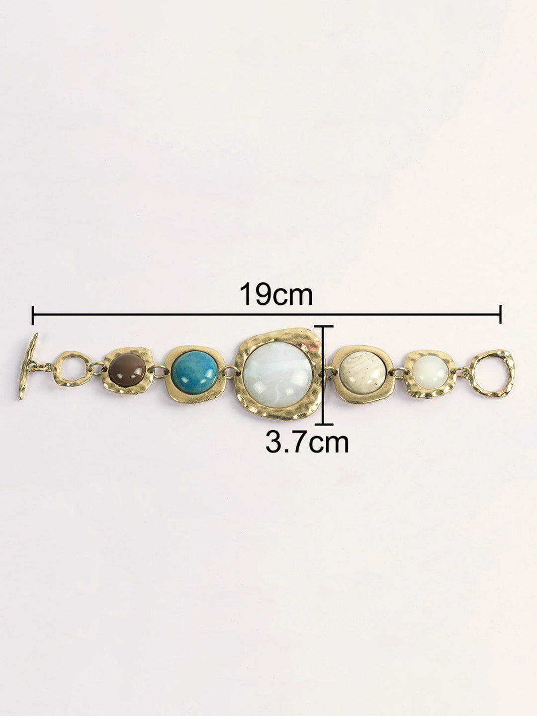 Bracelet à multiples pierres dorées