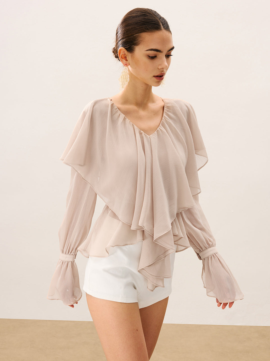 Blouse mi-transparente à volants superposés en mousseline