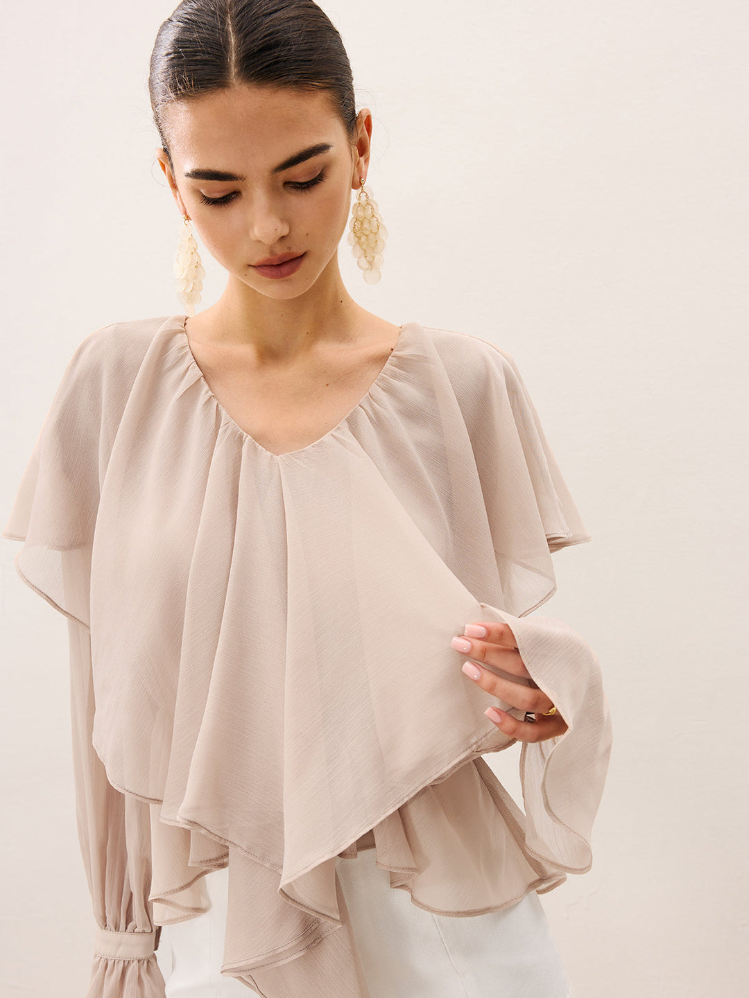 Blouse mi-transparente à volants superposés en mousseline