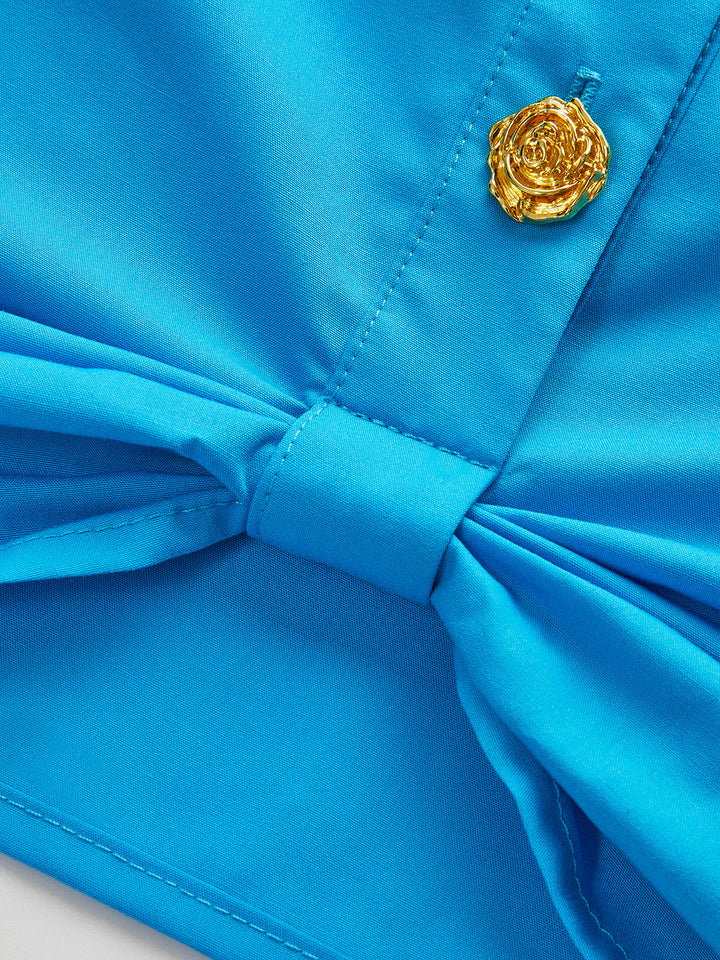 Blouse boutonnée à poche avec nœud avant