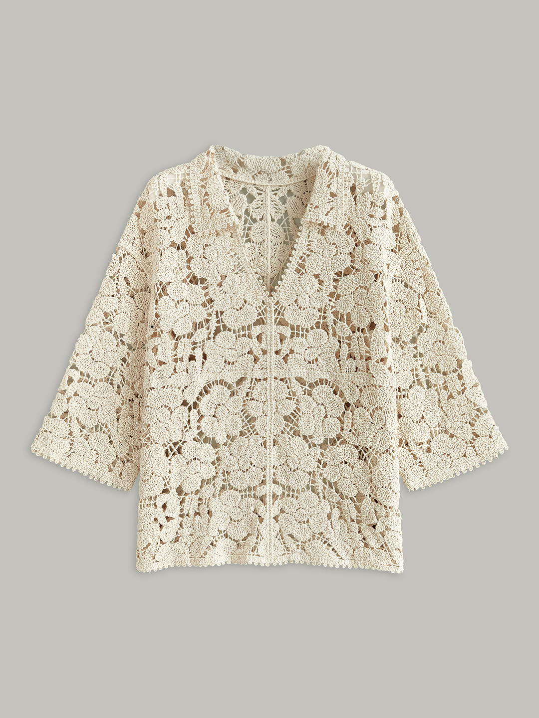 Haut en dentelle florale semi-transparente