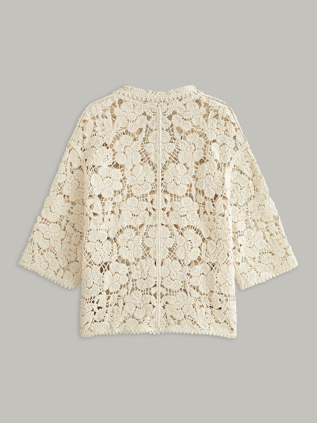 Haut en dentelle florale semi-transparente