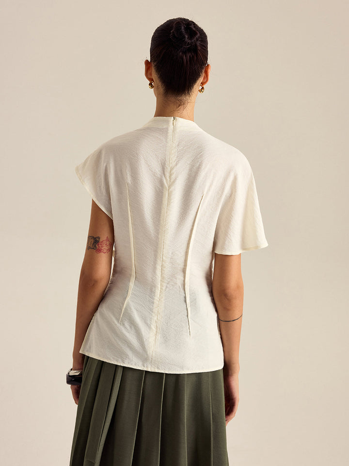 Blouse à col montant drapé