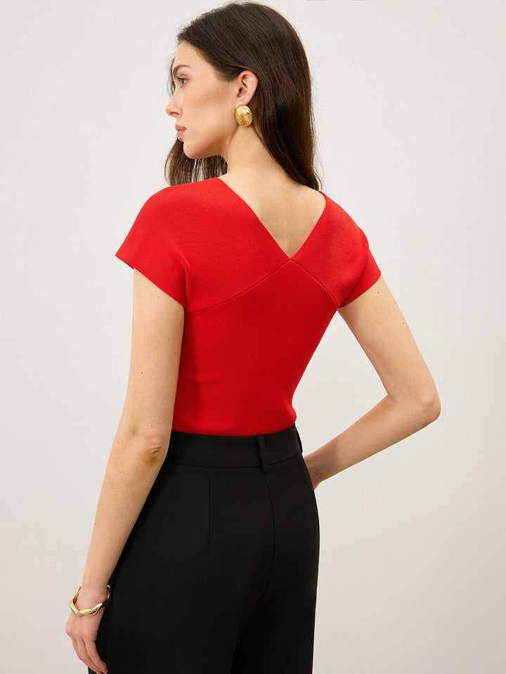 Haut en tricot à col en V torsadé avec découpe