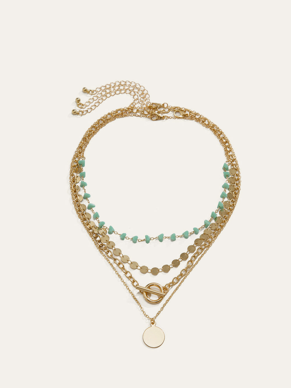 Collier à chaîne en or superposé avec perles de turquoise et pendentif circulaire