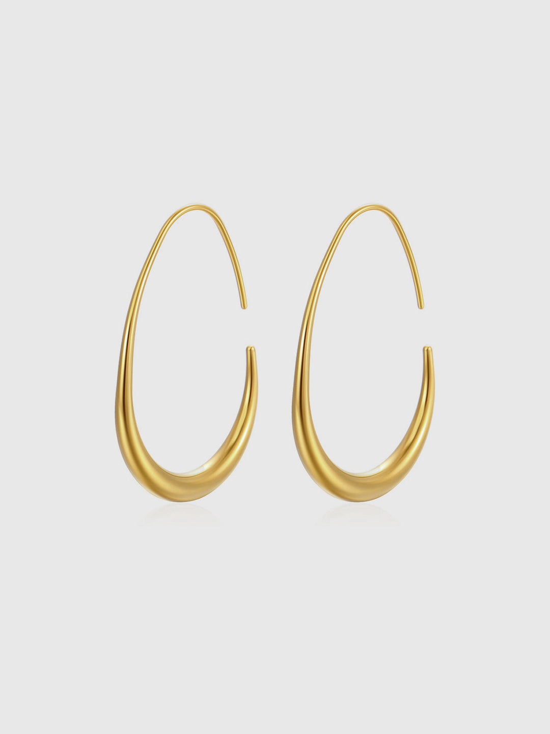 Boucles d'oreilles créoles fluides dorées