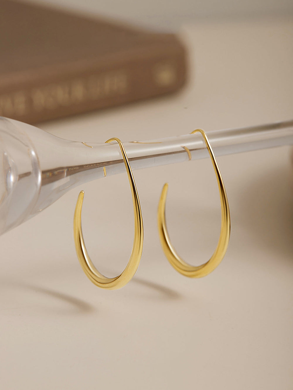 Boucles d'oreilles créoles fluides dorées