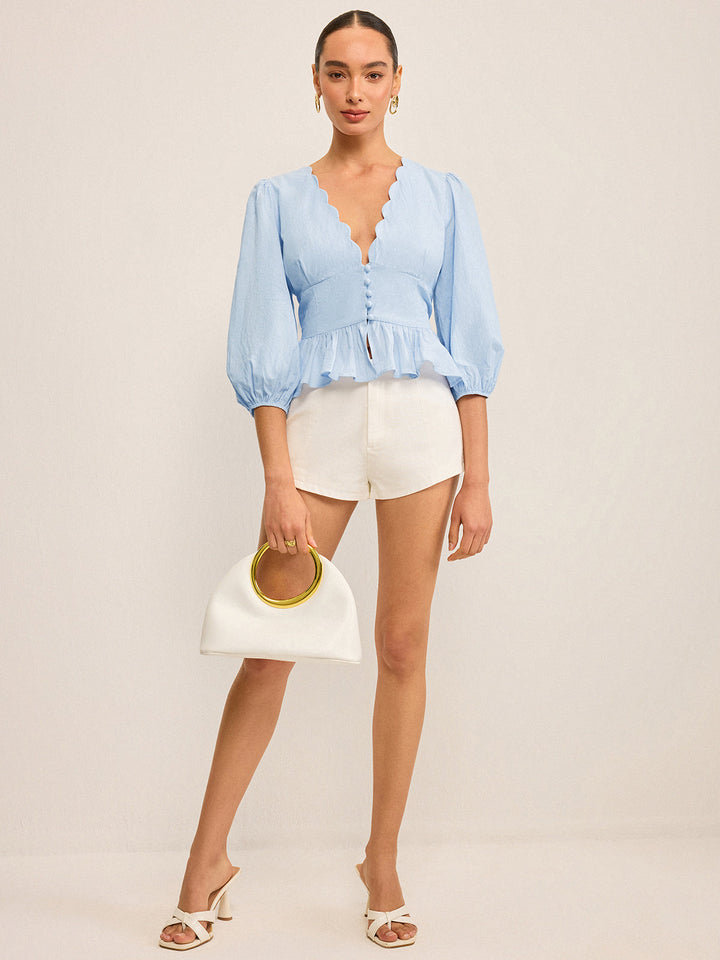 Haut Peplum à col en V festonné avec manches bouffantes
