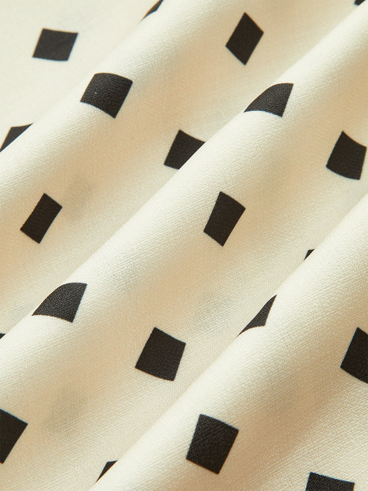 Robe mi-longue à pois avec bretelles festonnées