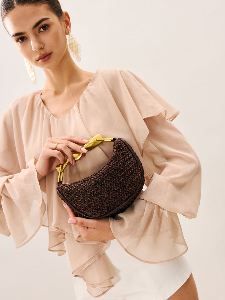 Sac à main tissé avec anse torsadée dorée
