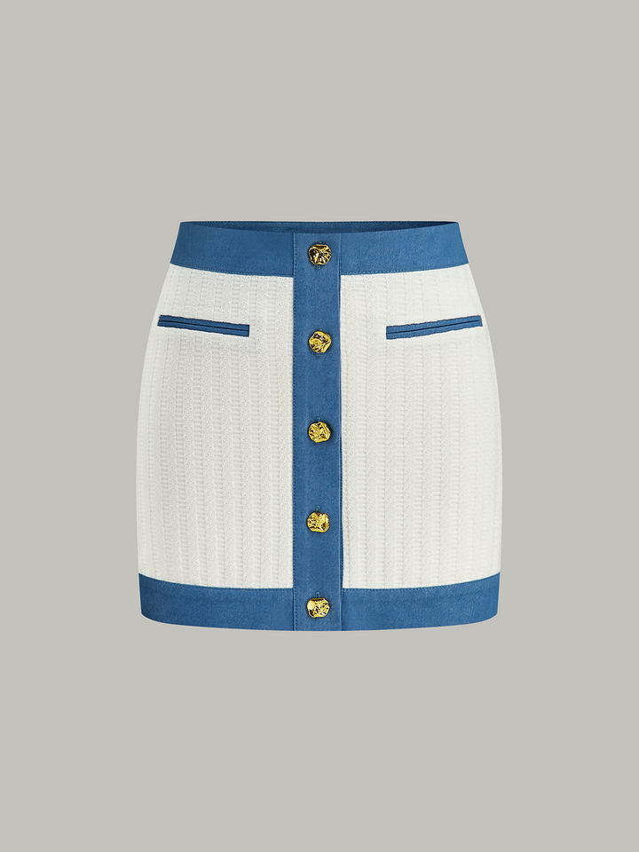 Mini-jupe en tricot avec bordure en jean et bouton en métal