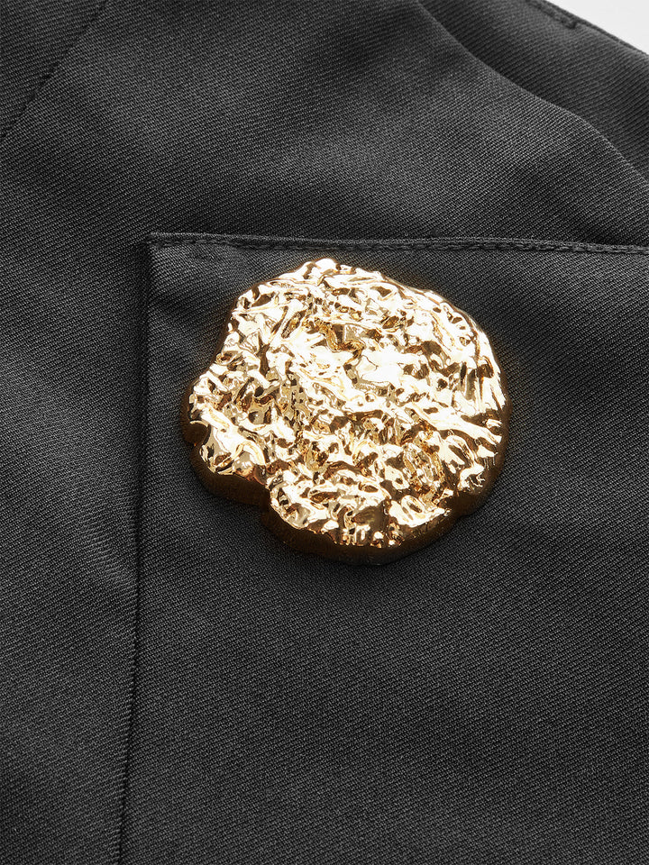 Shorts plissés taille mi-haute avec bouton métallique
