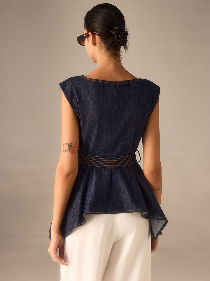 Haut péplum en jean ceinturé avec ourlet asymétrique