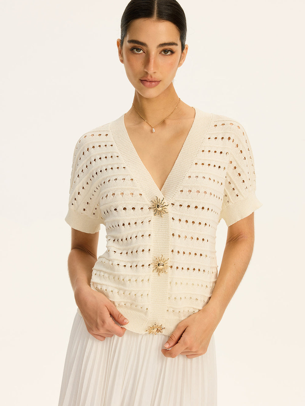Cardigan à col en V en tricot œillet avec bouton en métal