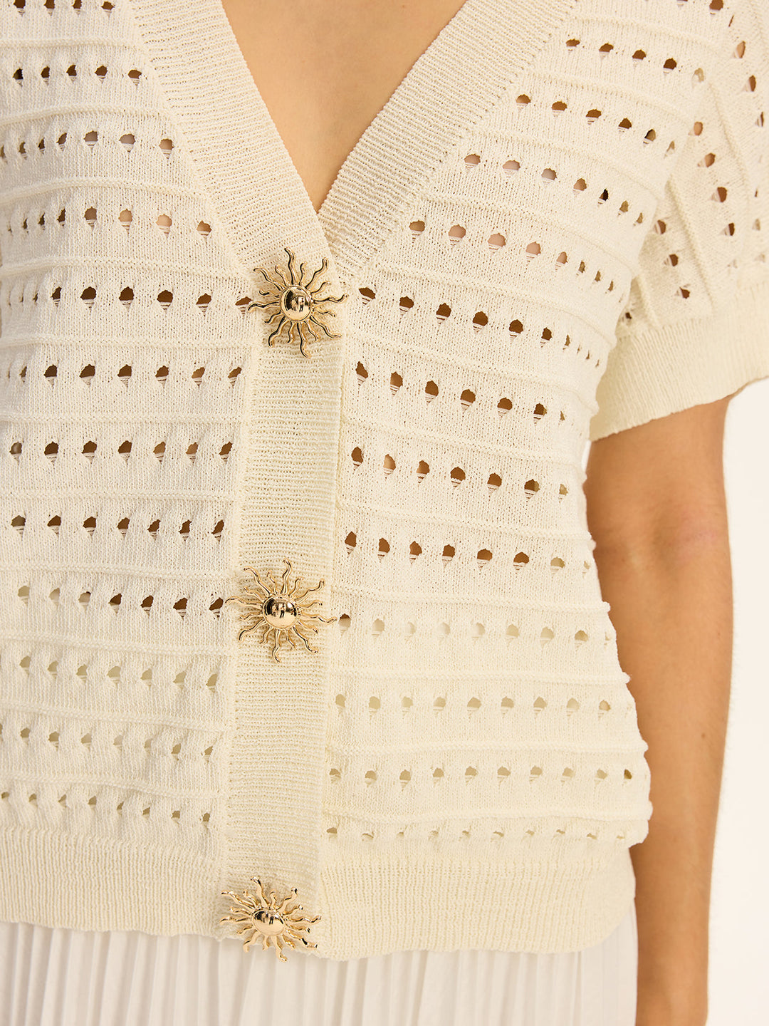 Cardigan à col en V en tricot œillet avec bouton en métal