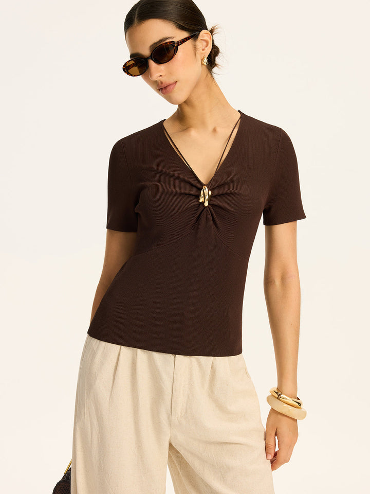 Haut en tricot côtelé avec détails métalliques