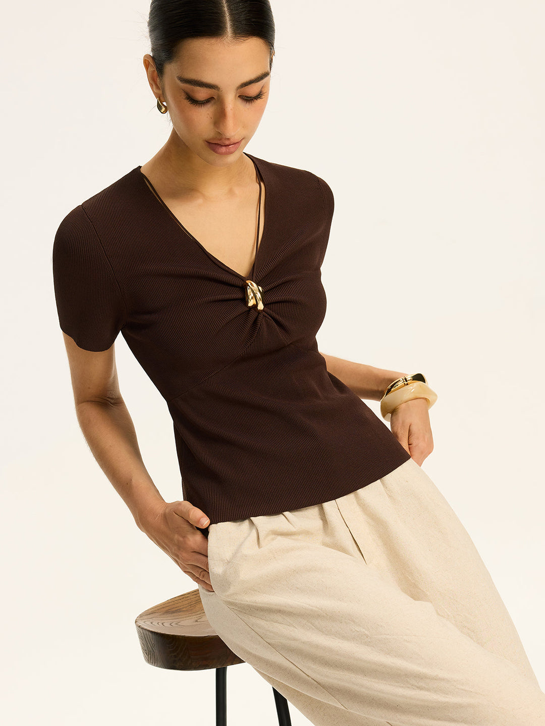 Haut en tricot côtelé avec détails métalliques