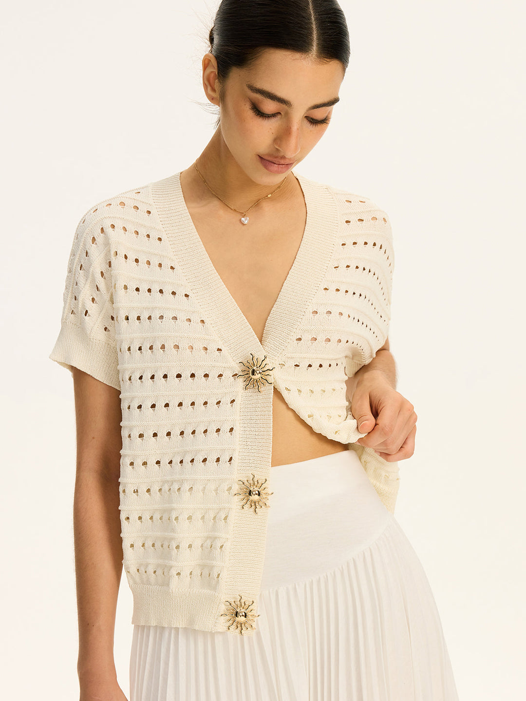 Cardigan à col en V en tricot œillet avec bouton en métal