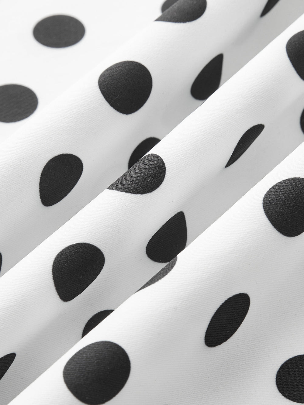 Robe mi-longue sans manches à pois